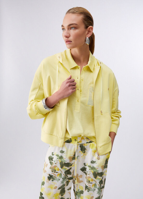 Felpa con ricami floreali