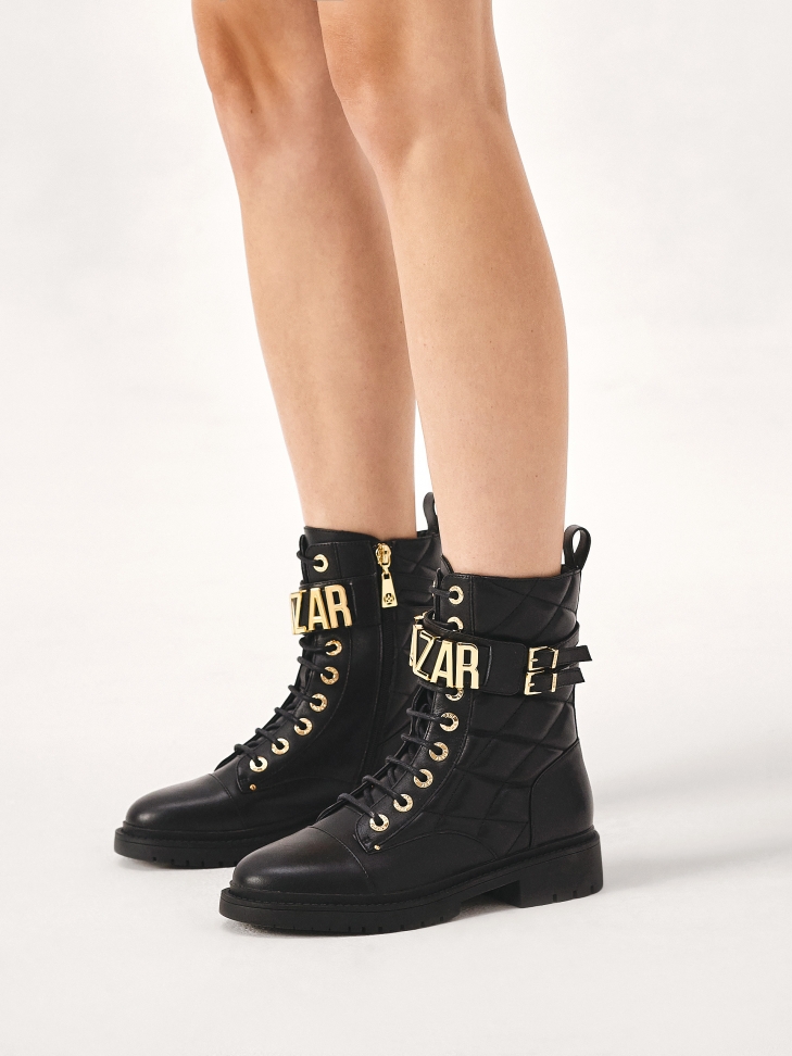 Leather boots with metal lettering