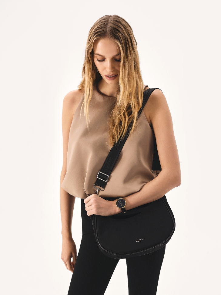 Black textile bag in the shape of a croissant