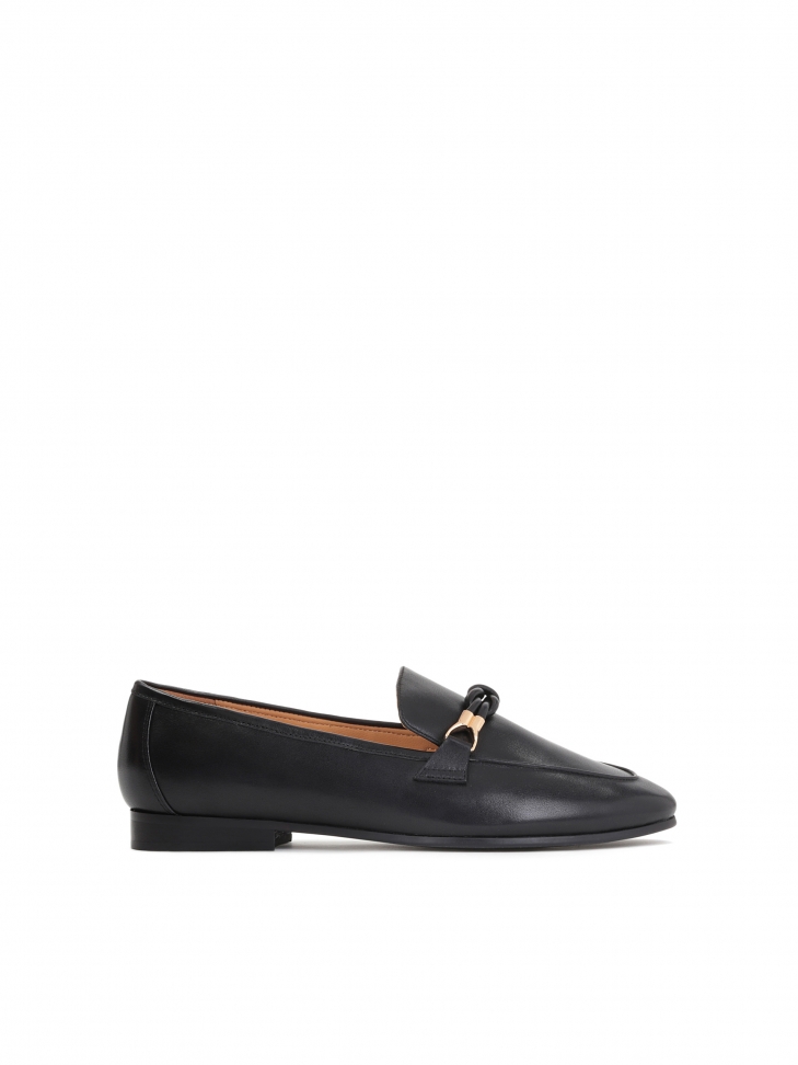 Black leather flat shoes on a flat heel