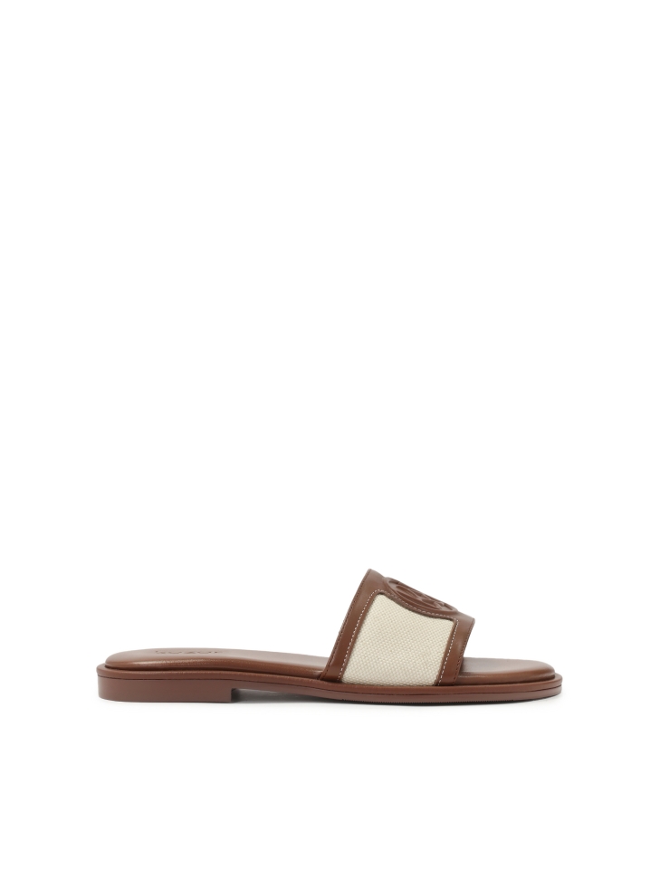 Flat slides in leather and fabric