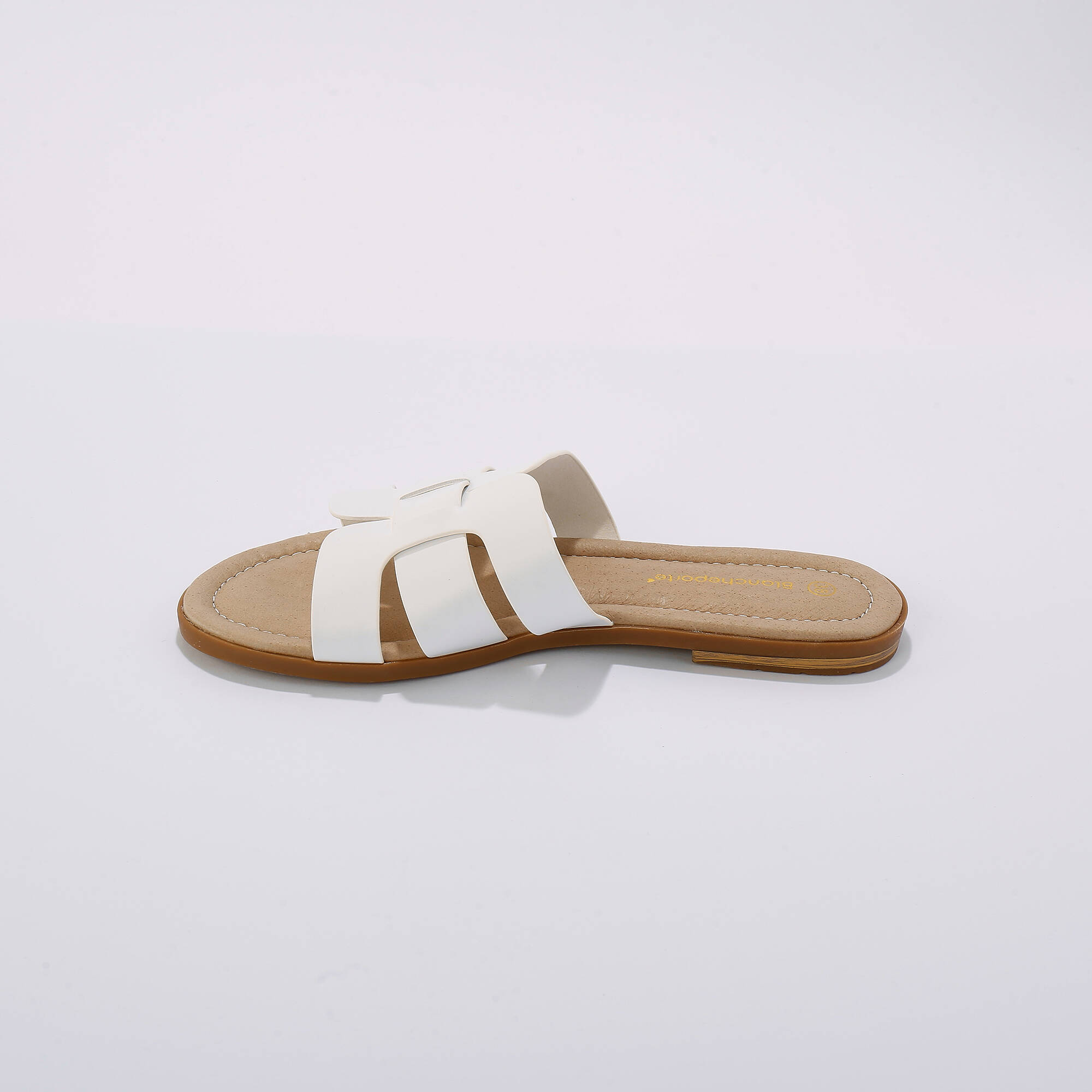 Mules plates bandes croisées