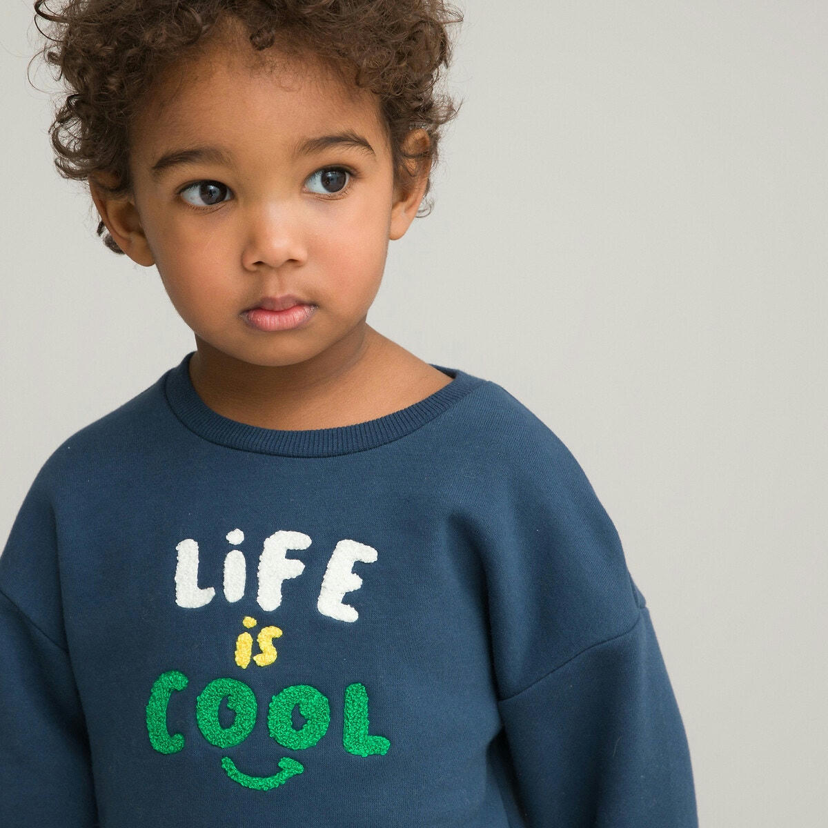 Sweat col rond en molleton, message en bouclette