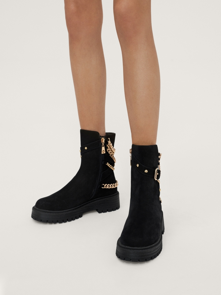 Nubuck flat ankle boots with a zipper decorated with chains