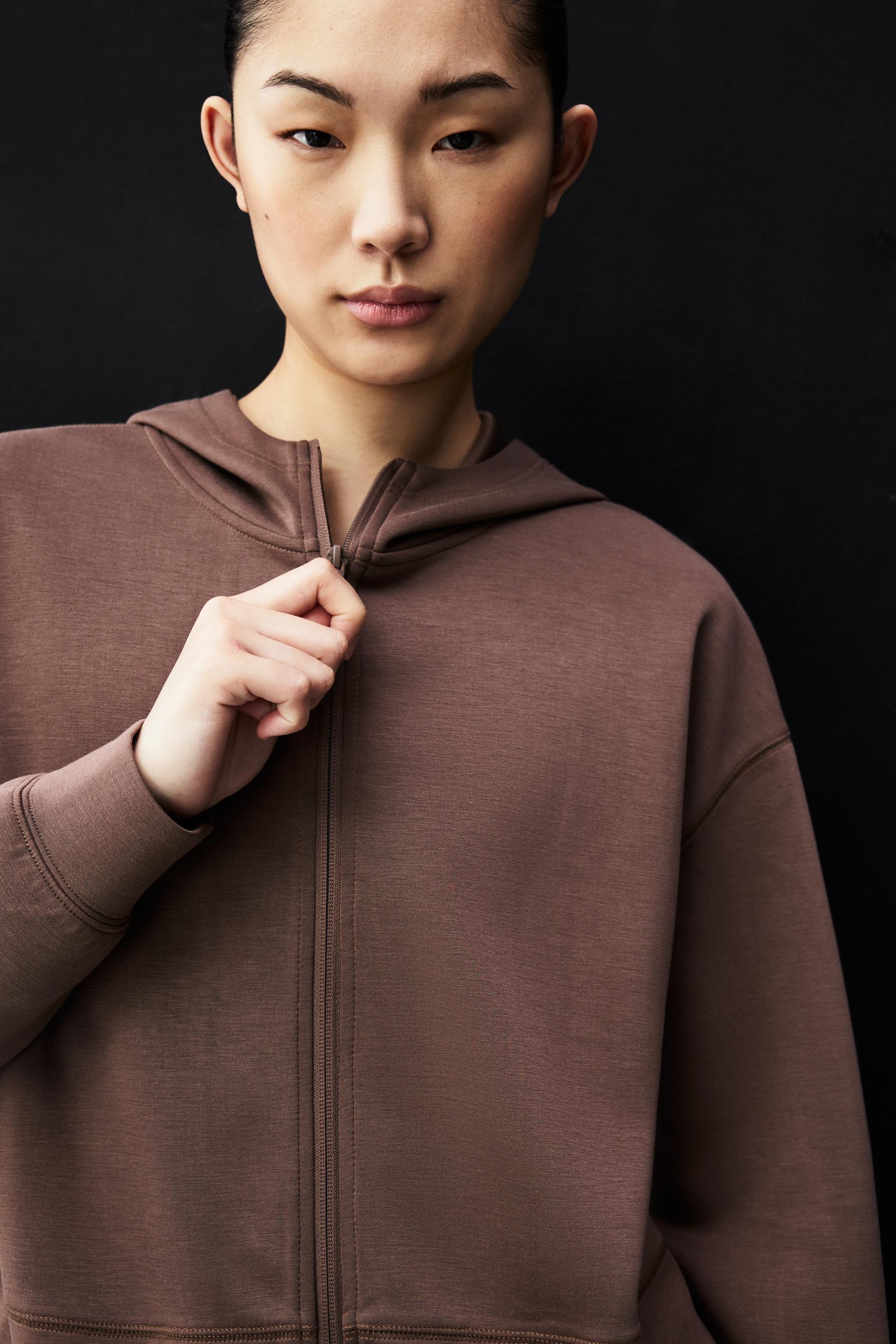 Sudadera cremallera cuello capucha