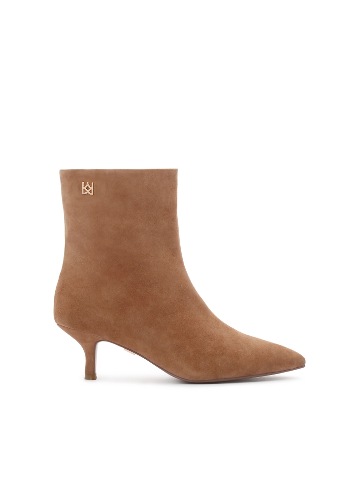 Light brown suede boots on a low stiletto heel