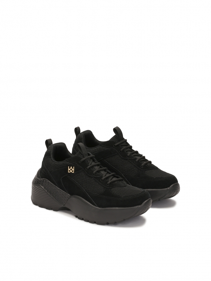 Black sneakers on a solid sole