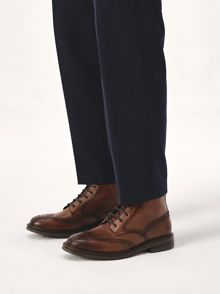 Brown lace-up boots with brogue decoration