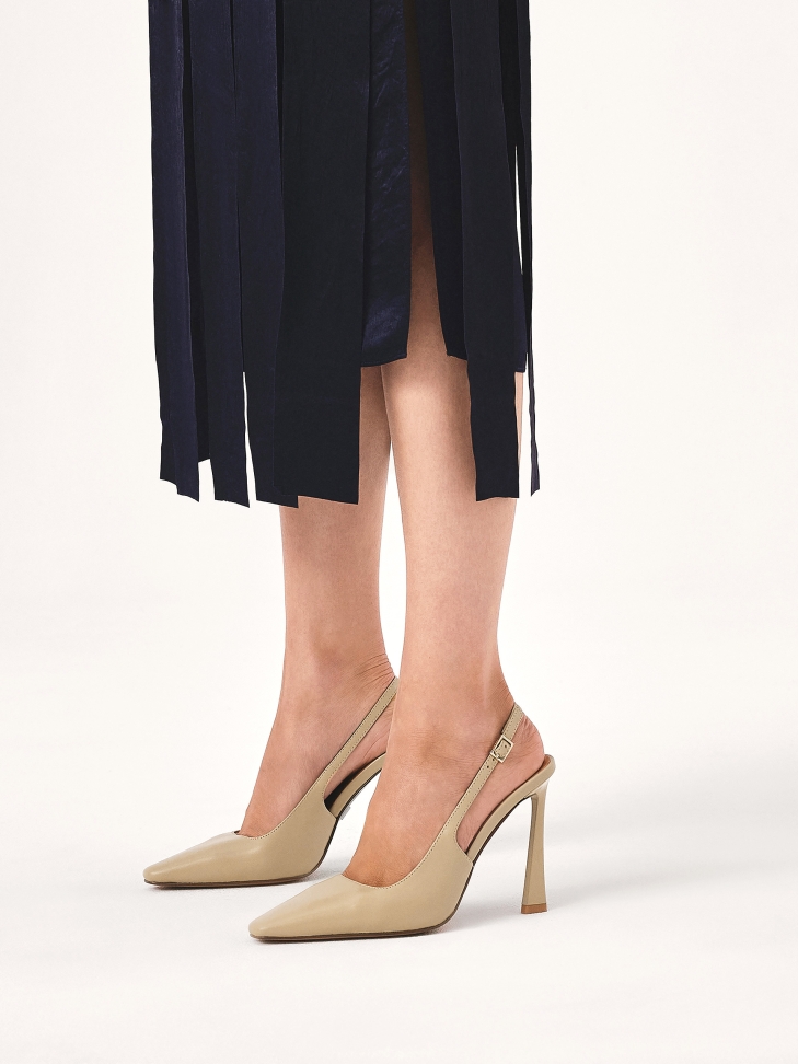 Beige pumps with a unique heel