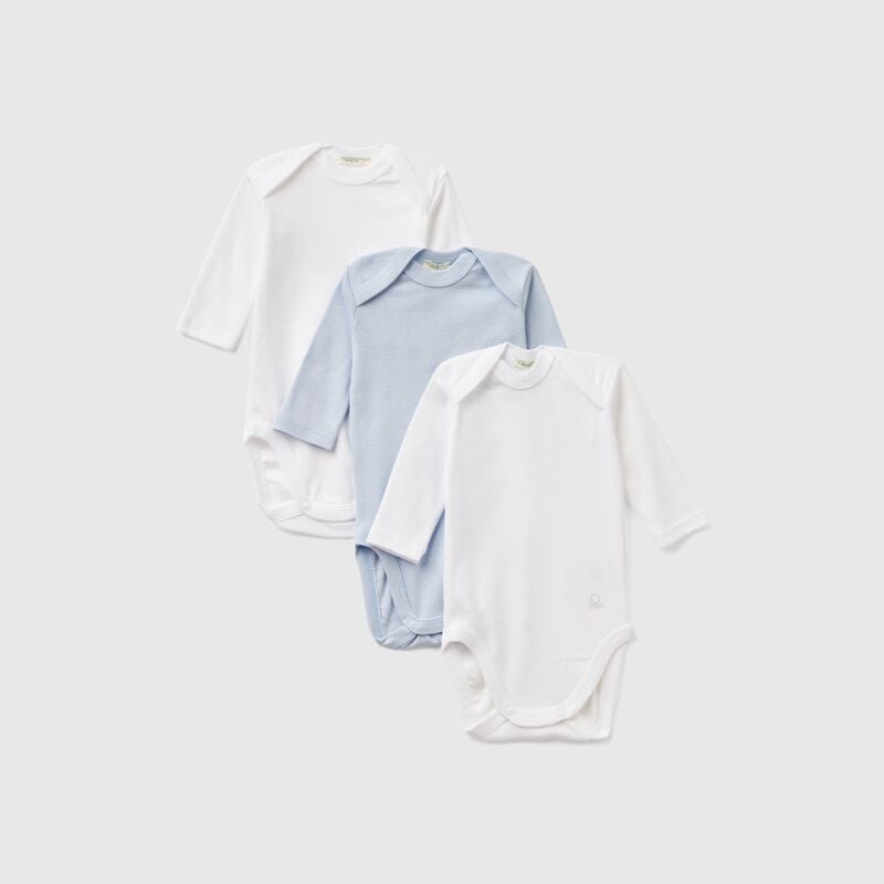 Three solid color bodysuits in cotton