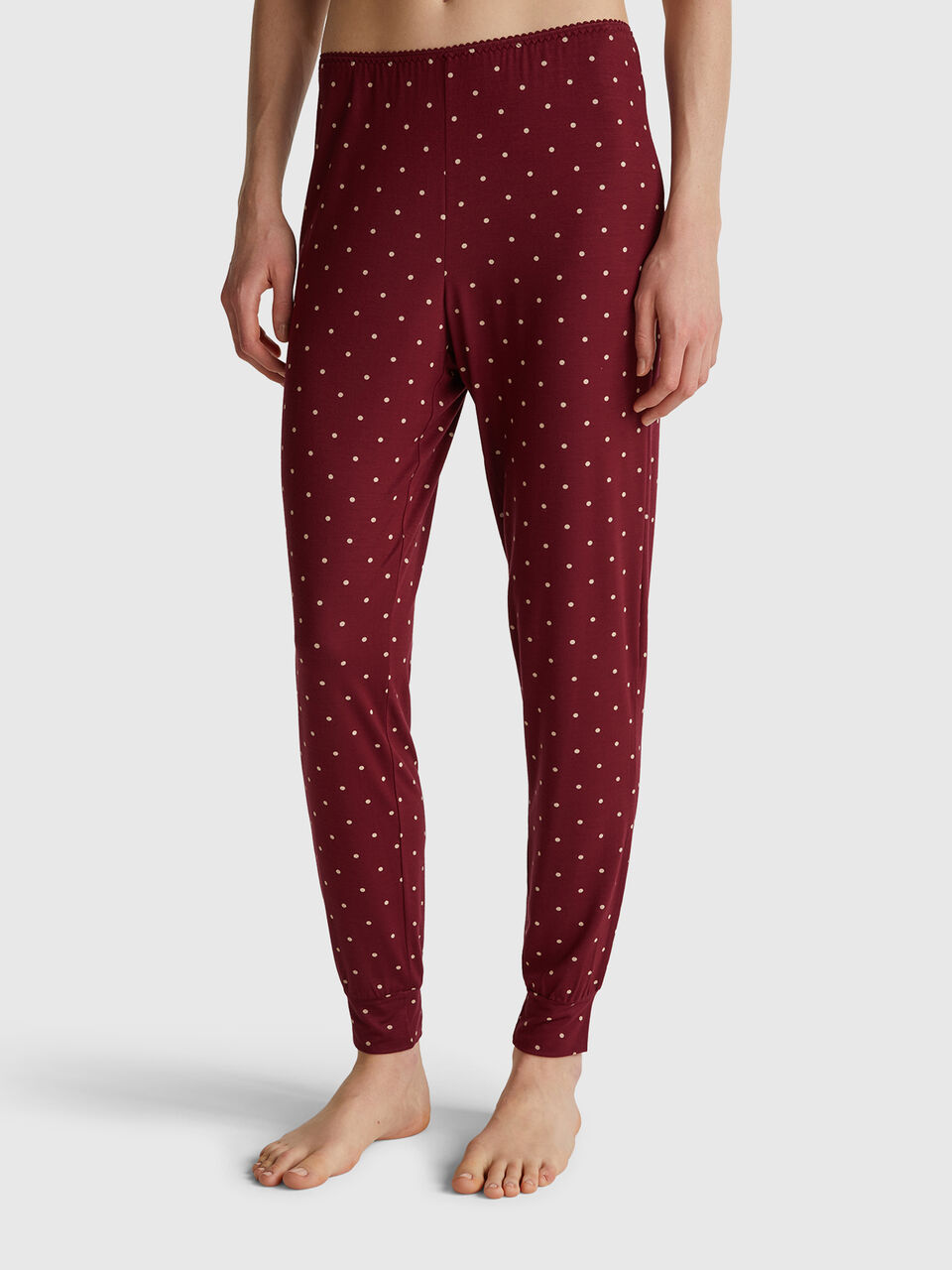 Red trousers with polka dot print