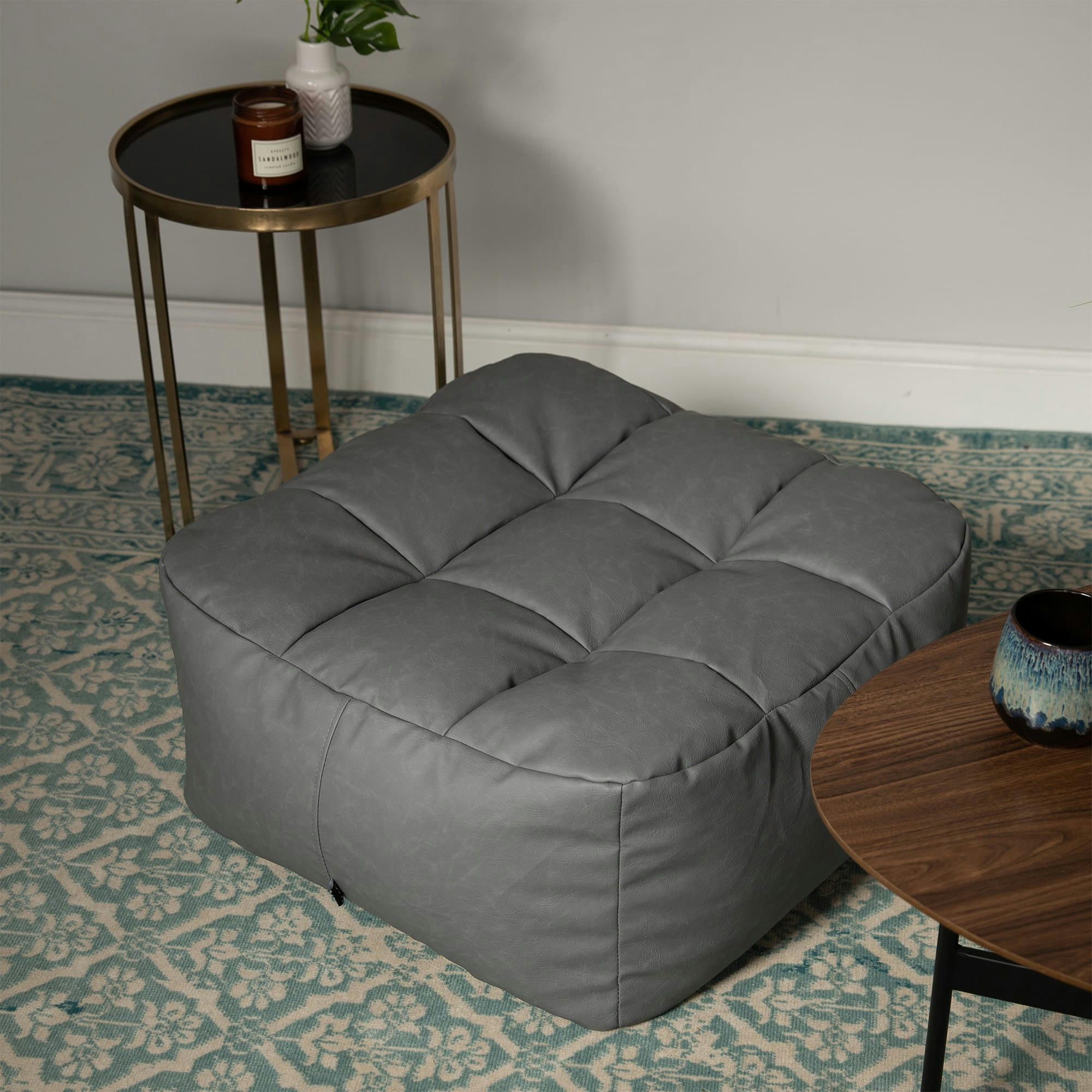 LUCIA - Pouf repose-pieds similicuir gris