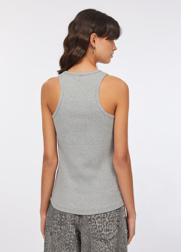 Top con applicazioni gioiello