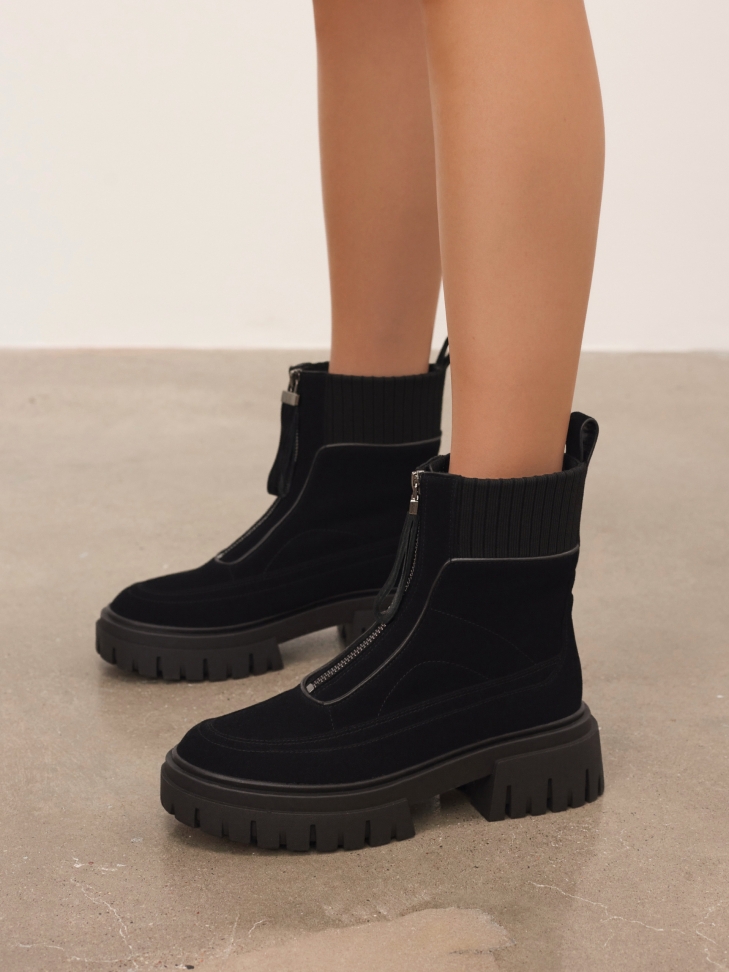 Suede boots with a zipper on the front of the upper