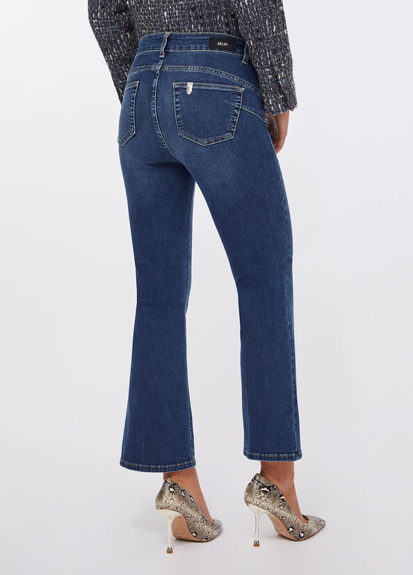 Jeans flare con bottoni gioiello