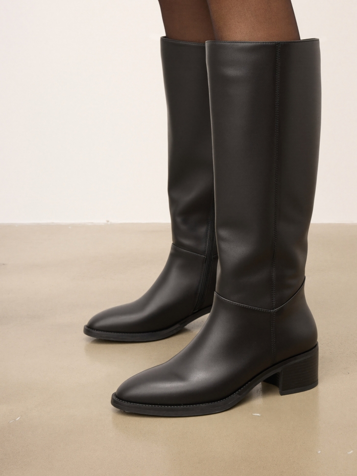 Black leather boots with a simple upper