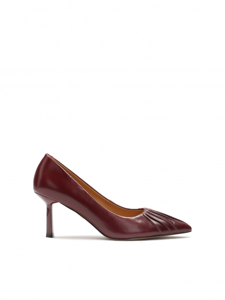 Maroon pumps with a striking notch on the nose