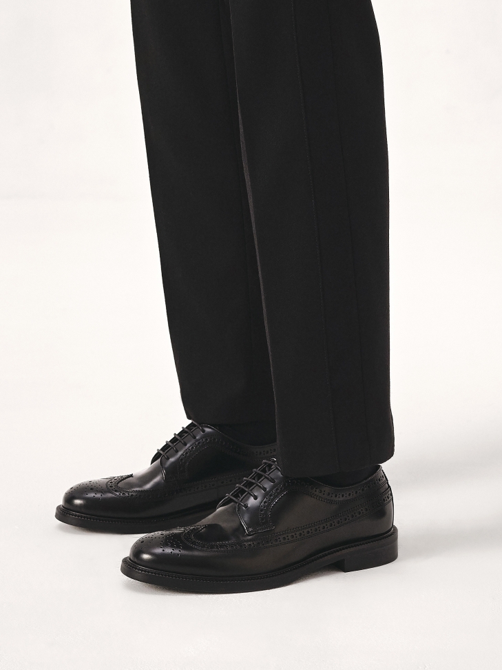 Black brogues on a leather sole