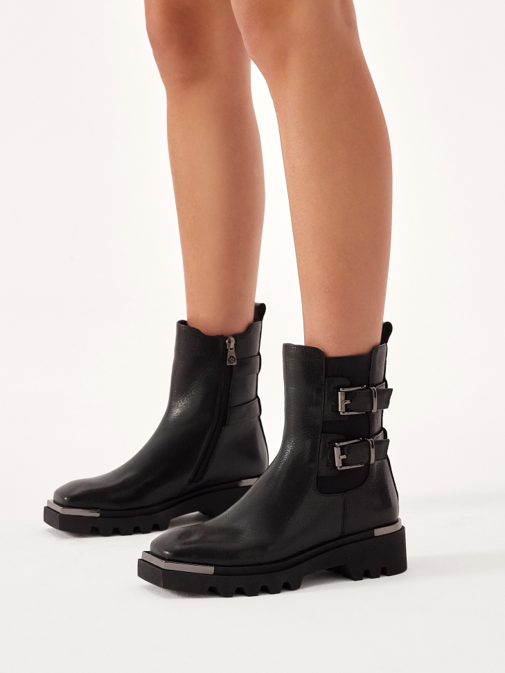Black leather boots in rock style