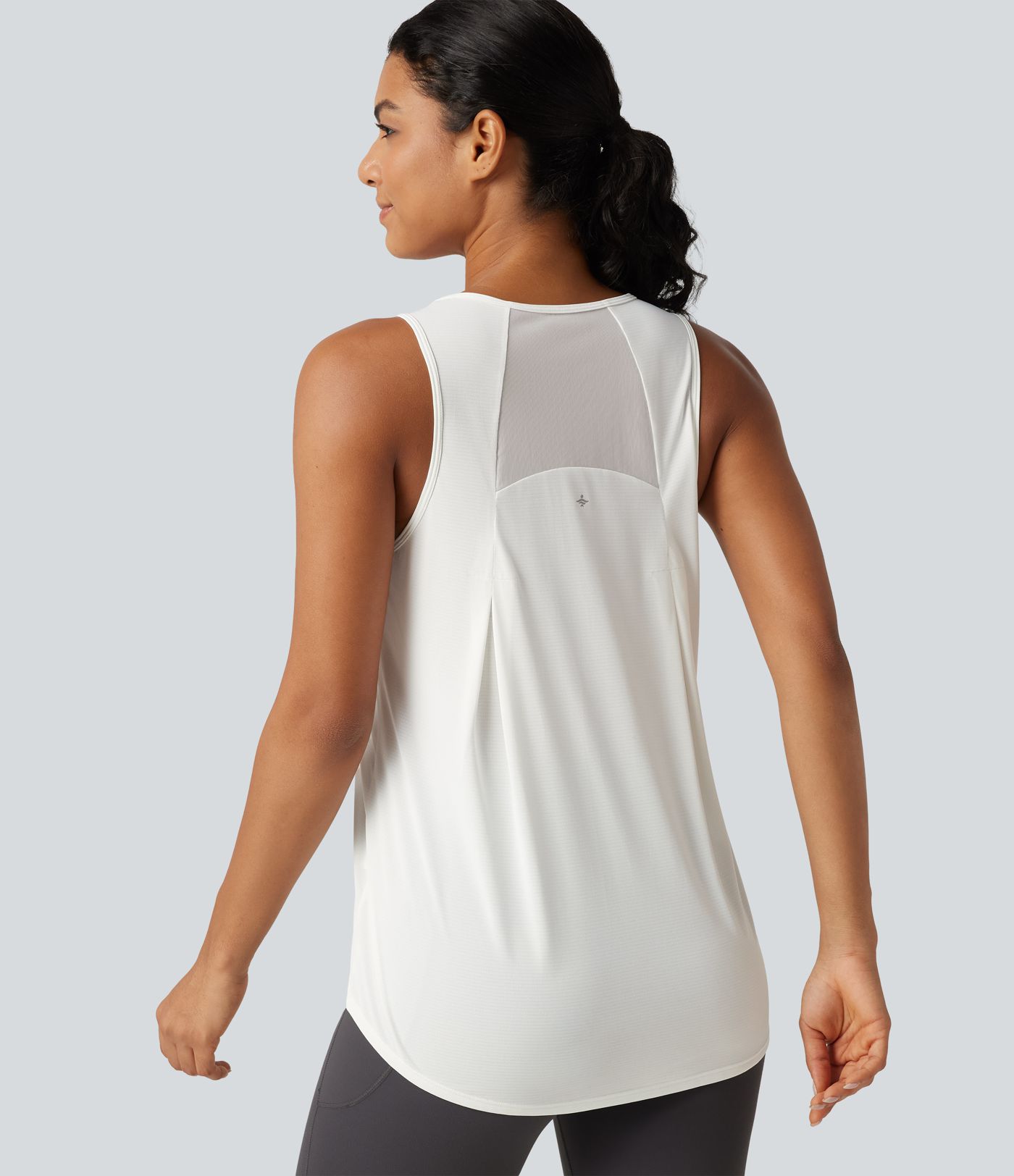 Débardeur de running longueur allongée en mesh contrasté avec ourlet arrondi