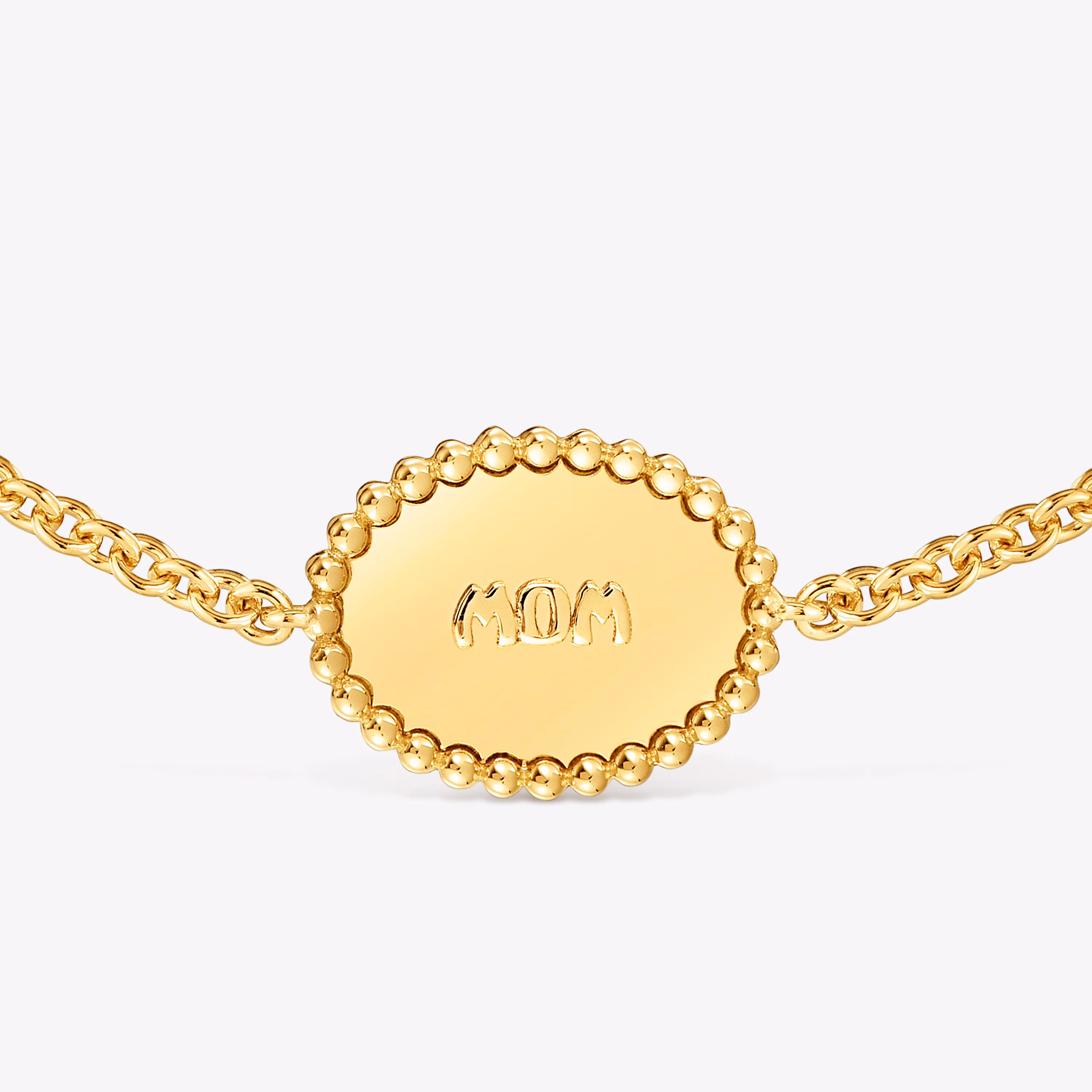 Pulsera cadena con baño de oro 18 kt sobre plata placa TOUS Mom