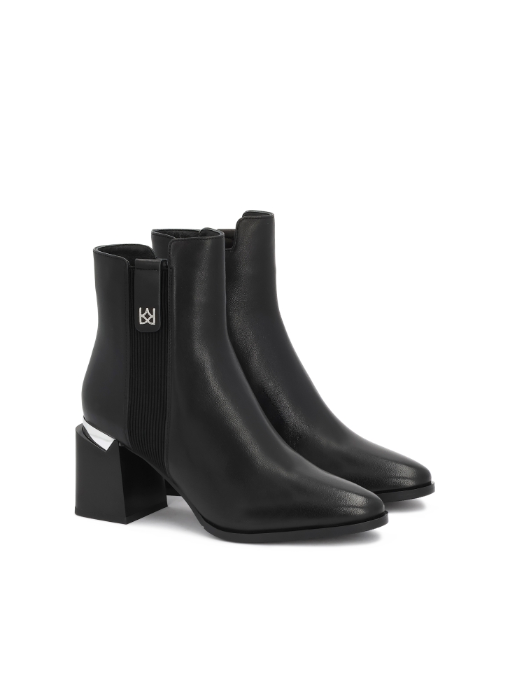 Black leather boots with metallic detailing
