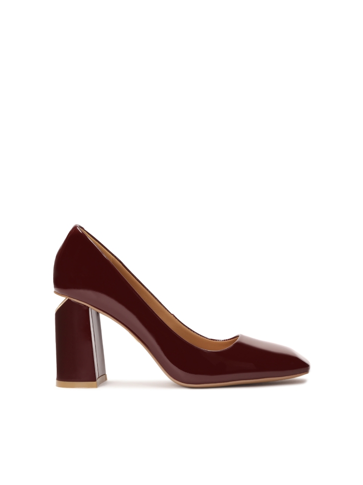 Maroon pumps with logo embellishment on the heel