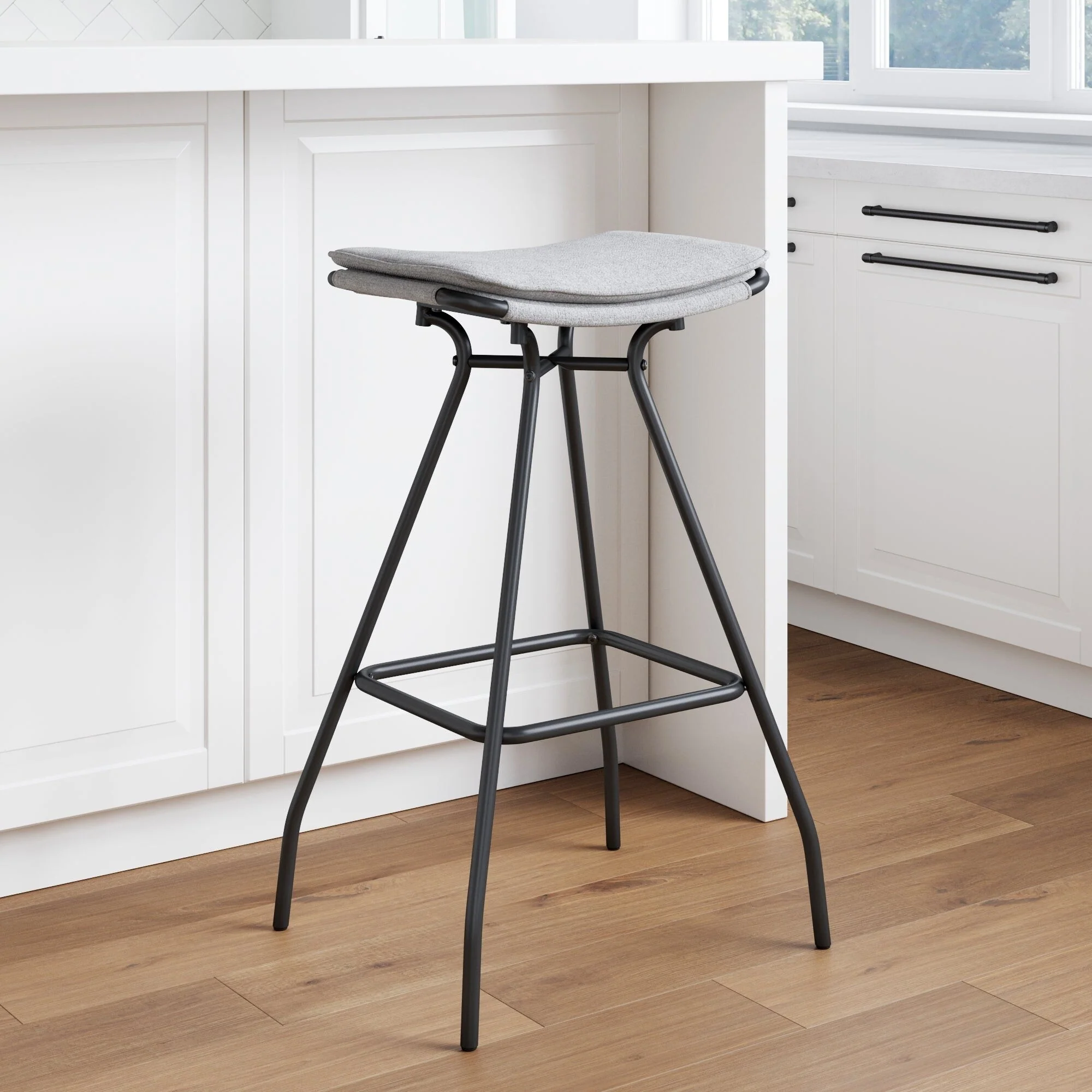 Nathan James Dominique Industrial Backless Kitchen Bar Stool with Brown Leather Saddle Seat and Metal Base