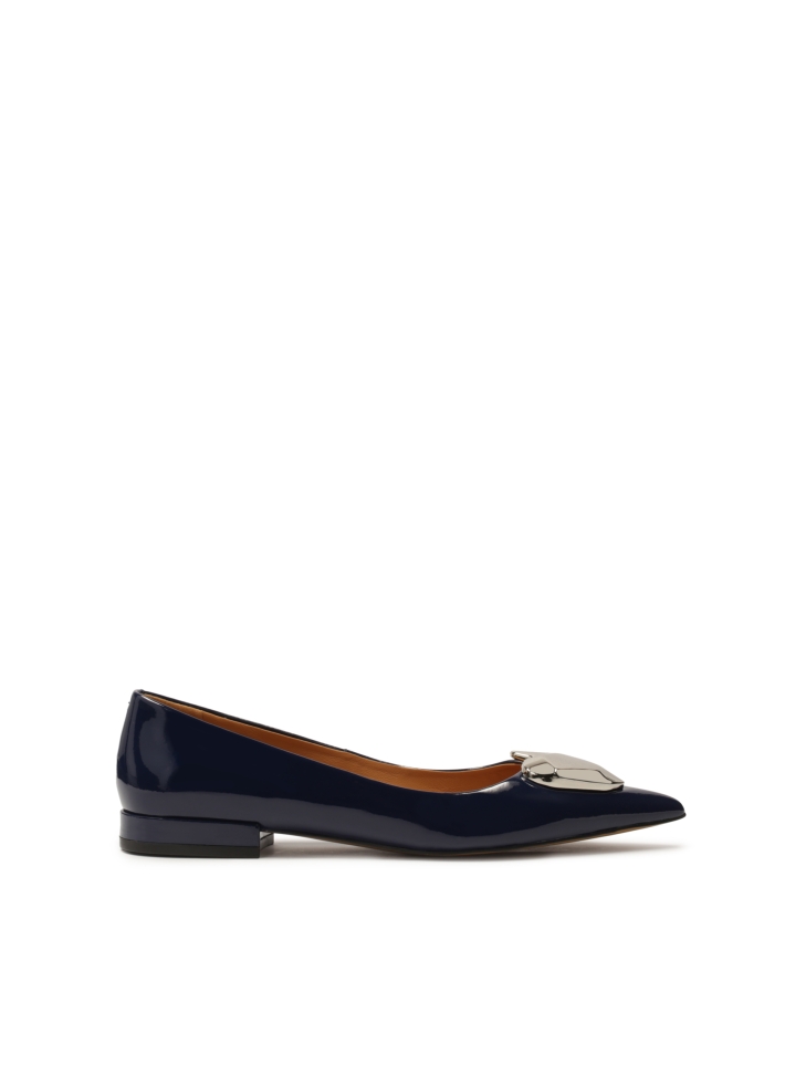 Navy blue flat pumps with large embellishment
