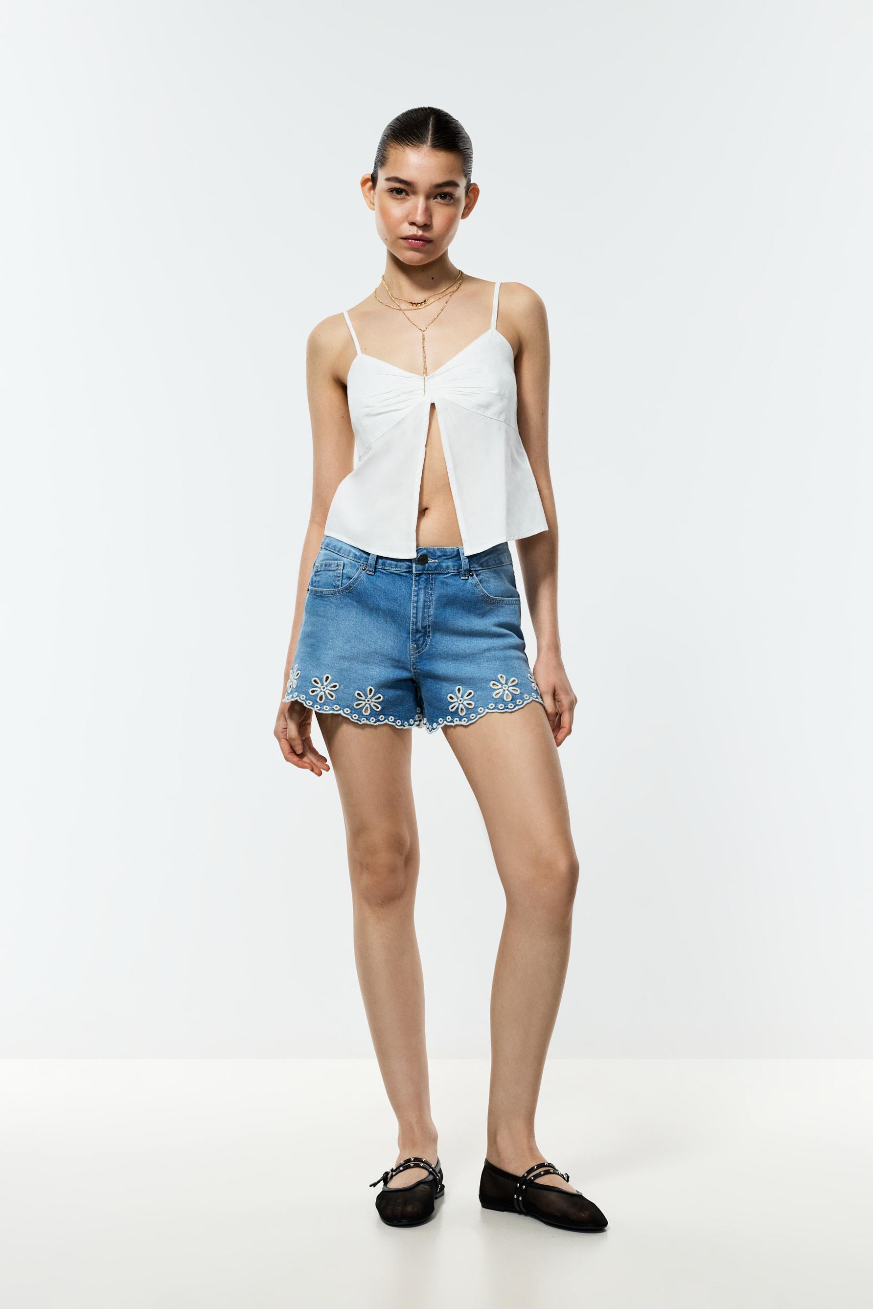 Short denim bordado suizo