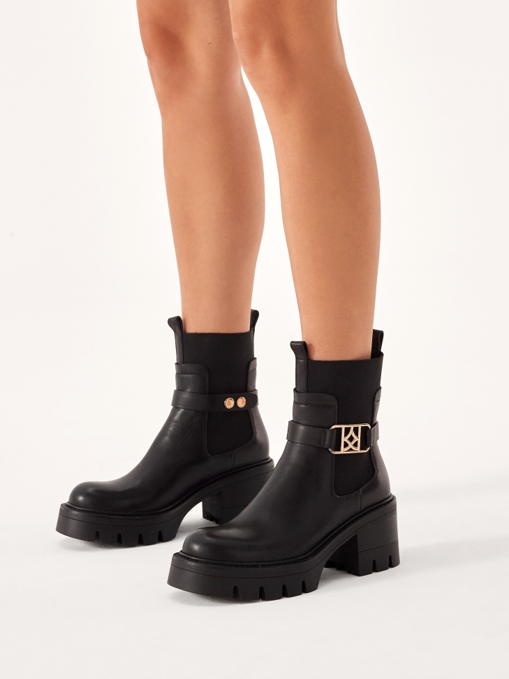 Slip-on boots with decorative detachable strap