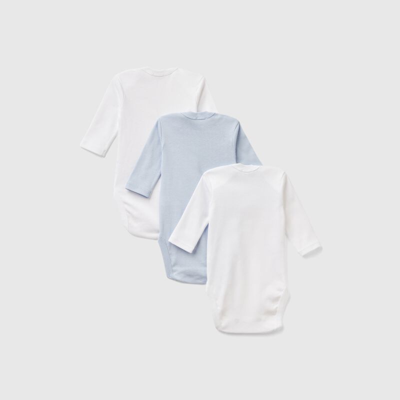 Three solid color bodysuits in cotton