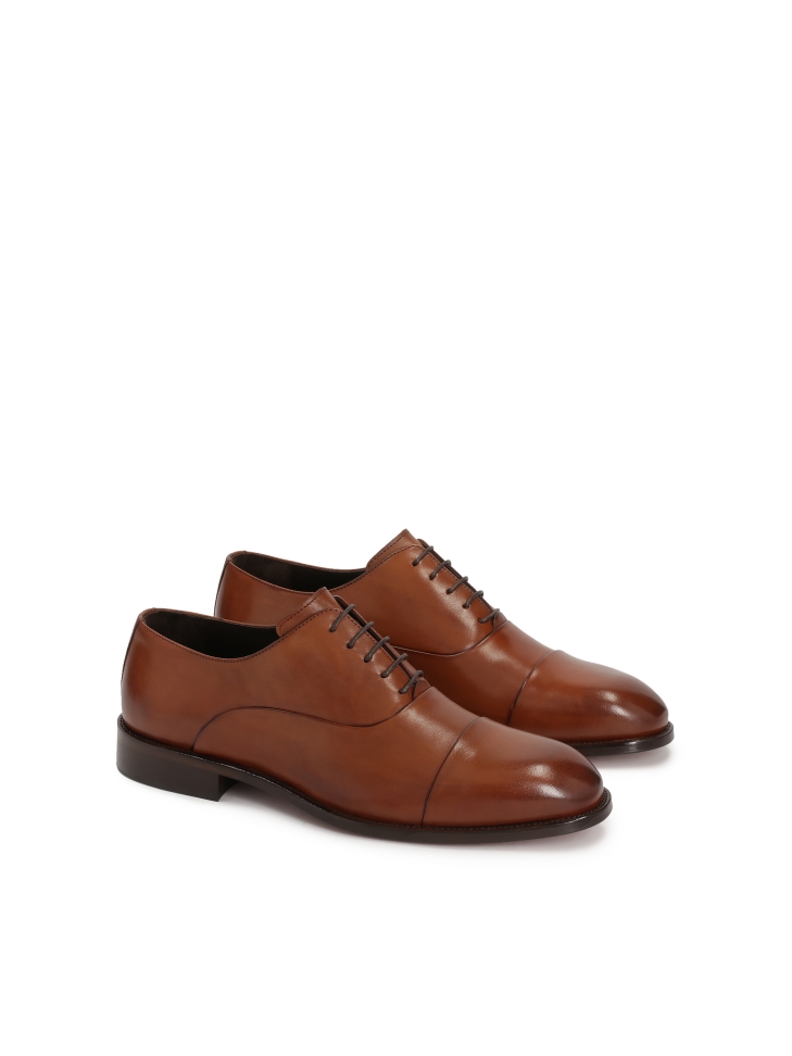 Elegant men's shoes on a leather sole