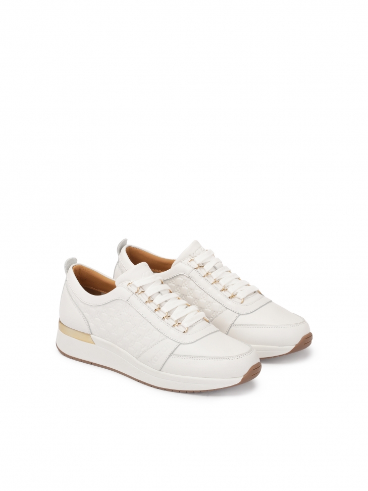 White sneakers on a raised sole