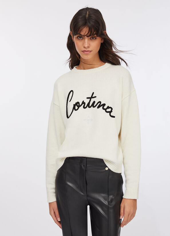 Maglia con scritta ricamata