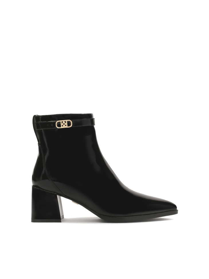 Patent leather black boots on a post