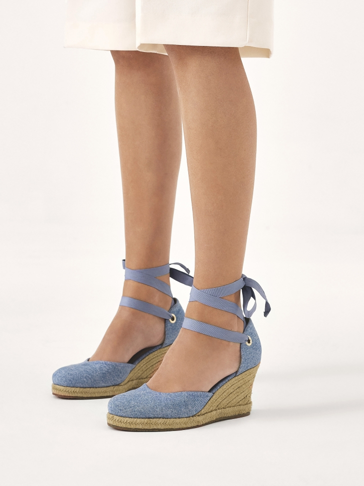 Blue knotted sandals on a platform heel
