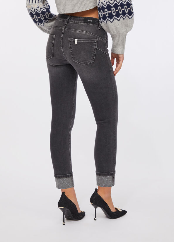 Jeans skinny con risvolto