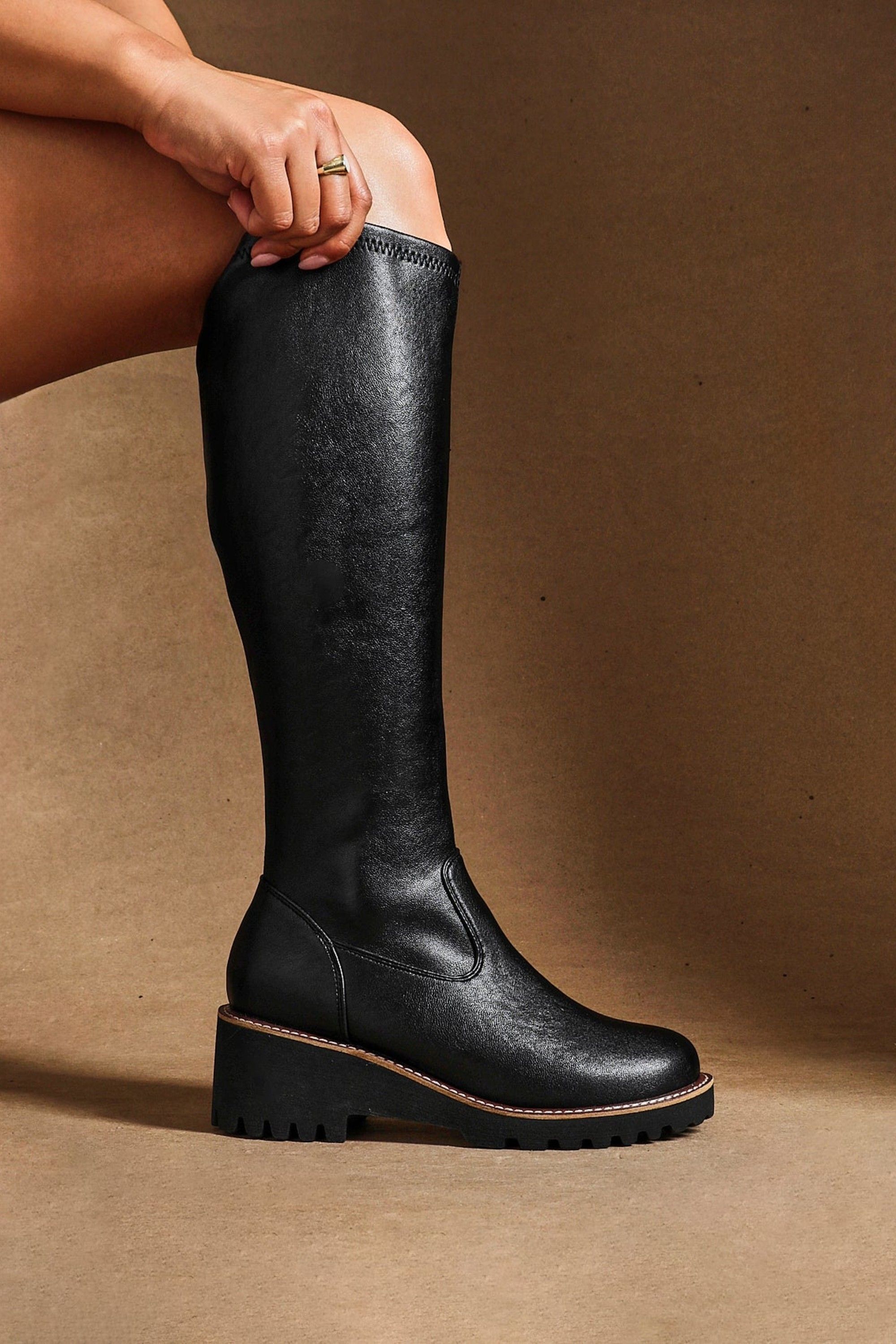 Linzi Maintain Wide Fit Black Faux Leather Stretch High Leg Wedge Boot
