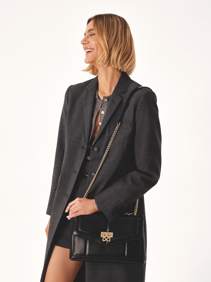 Black shoulder bag with sliding chain