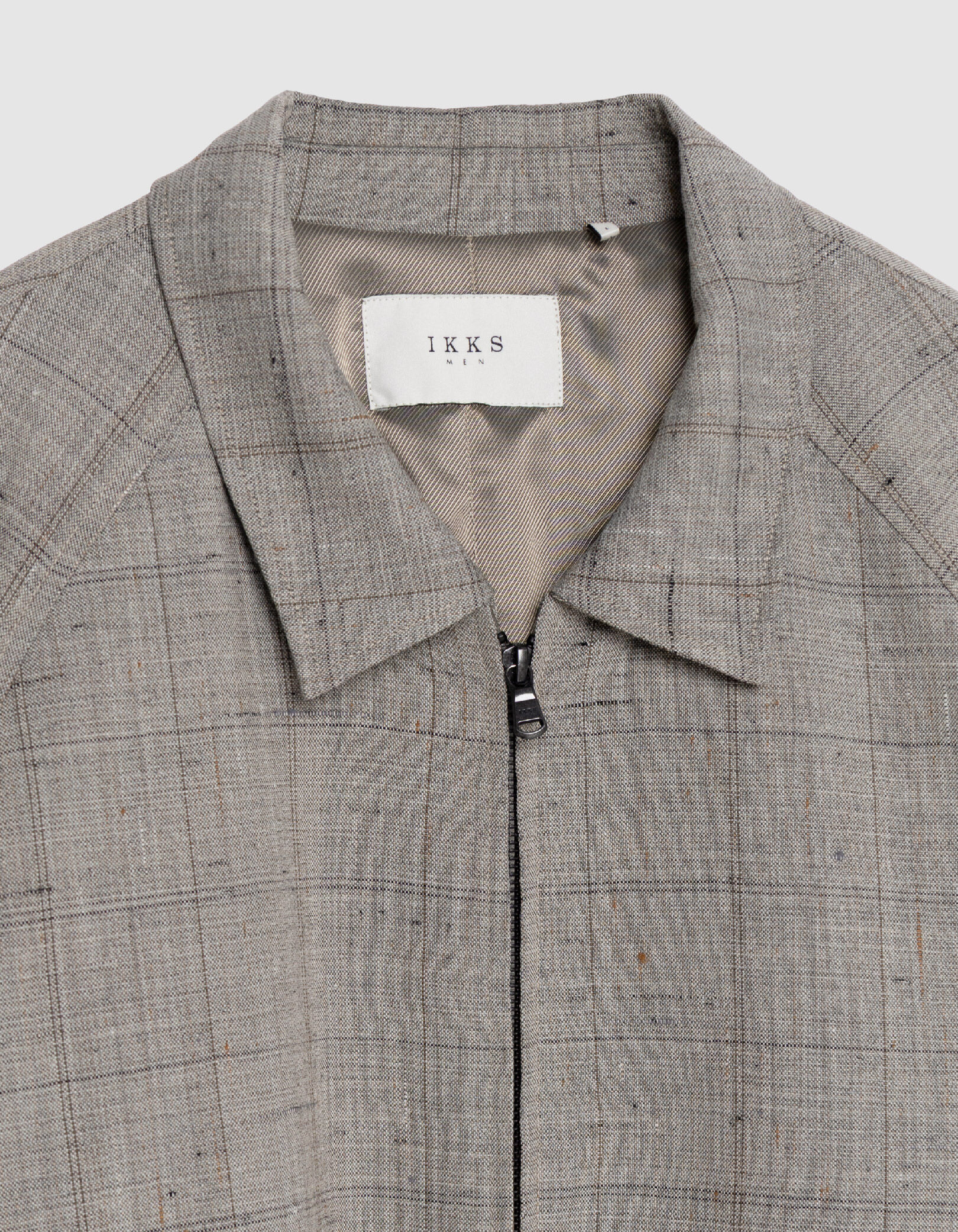 Bomber taupe zippé motif carreaux Homme