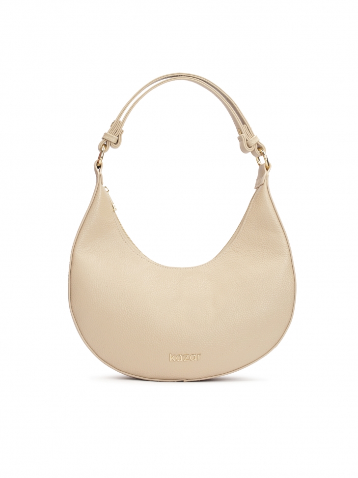Beige leather handbag with a unique shape