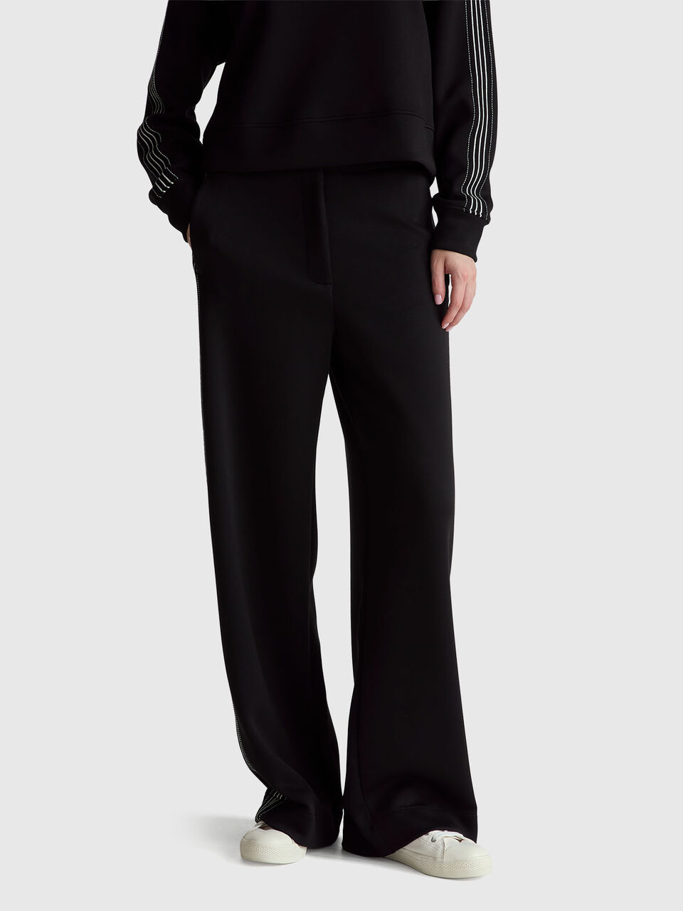 Wide trousers with side stripes