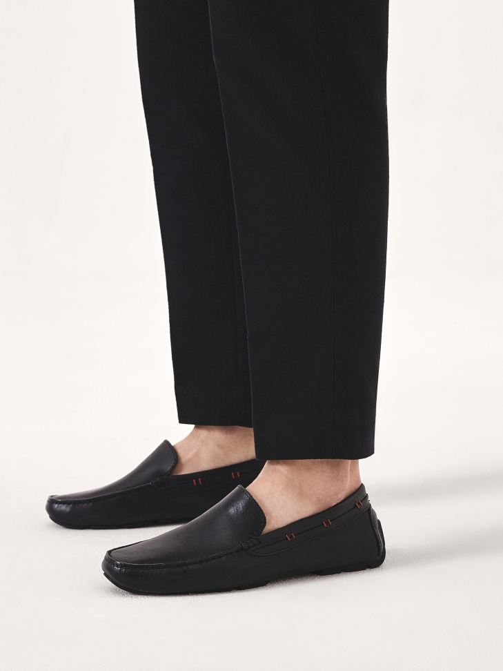 Black moccasins with red accents