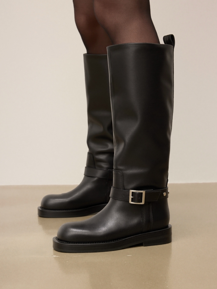 Black leather boots with strap around the ankle