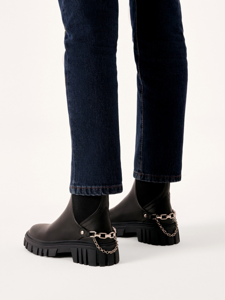 Slip-on boots with chain at heel