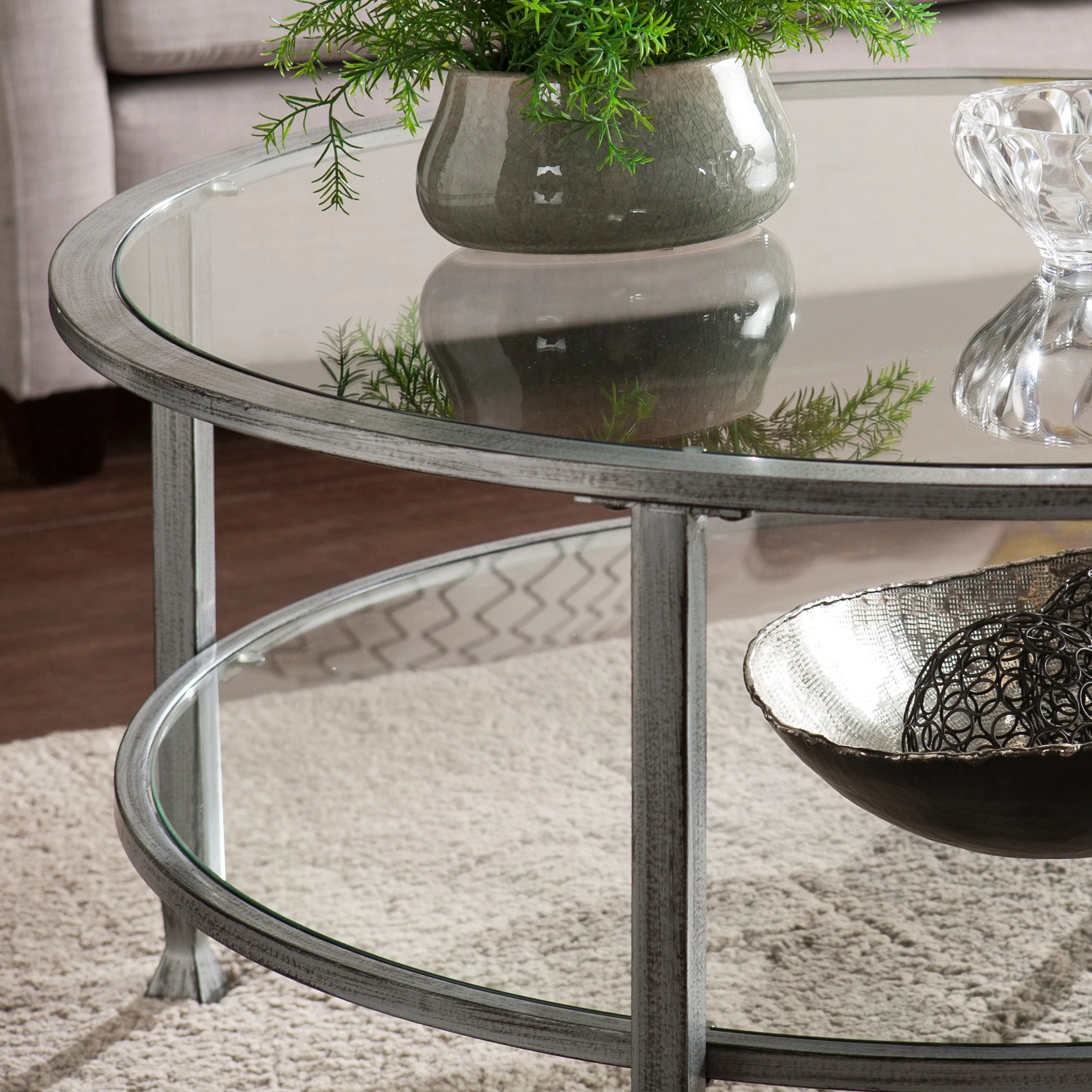 SEI Furniture Glenn Distressed Silver Round Coffee Table with Glass Top and Shelf