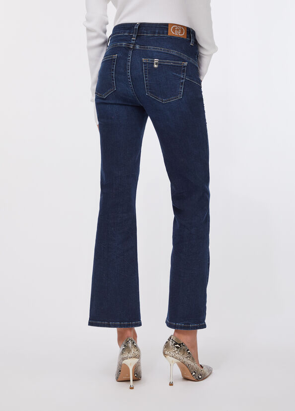 Jeans flare cropped con strass
