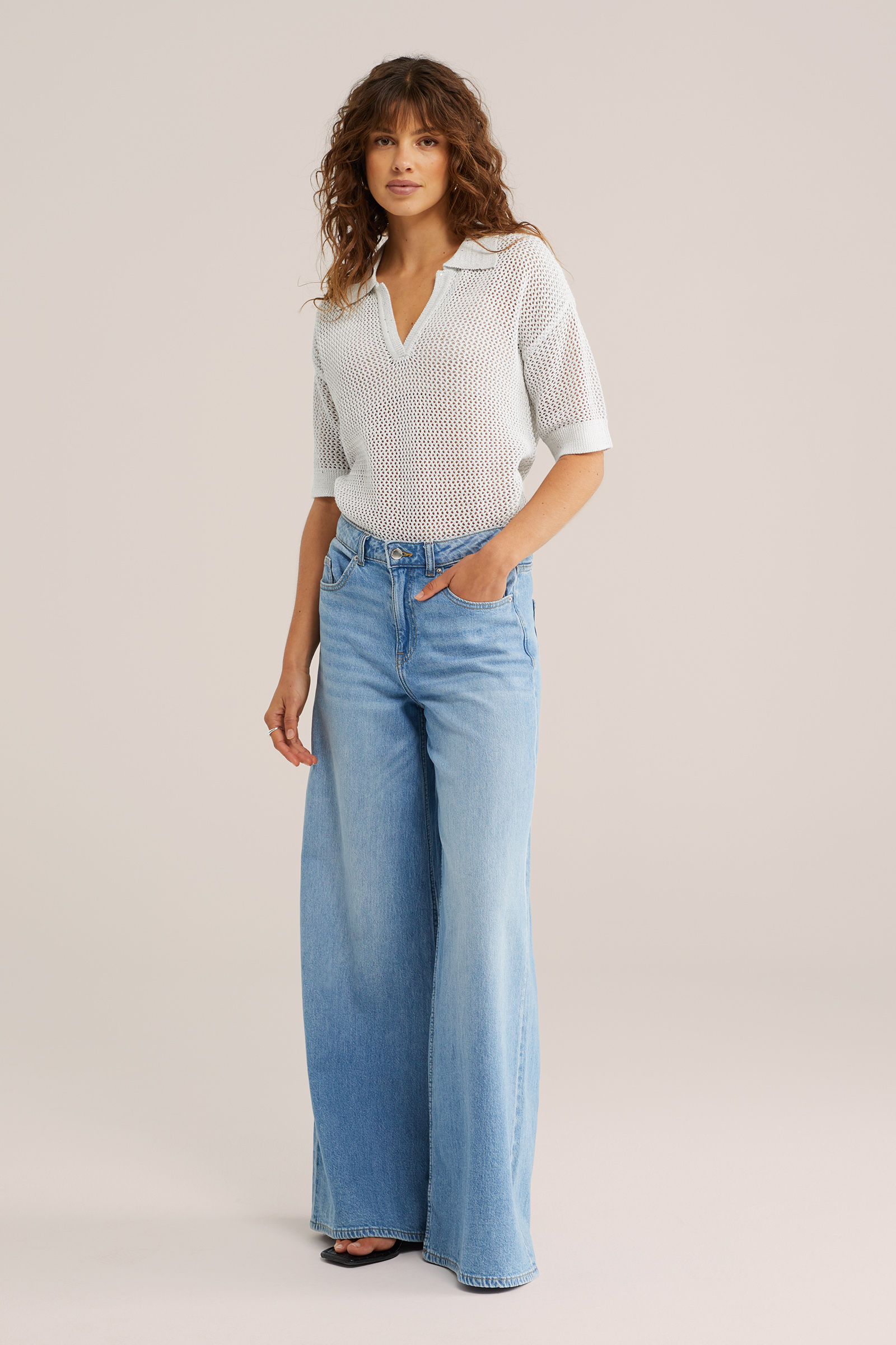 Dames gebreide polo met opengewerkte structuur