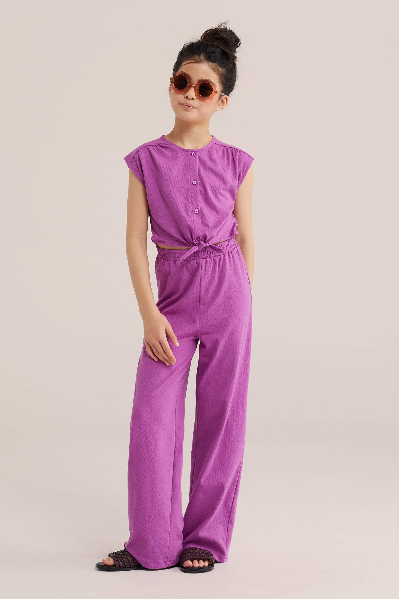 Meisjes jumpsuit met structuur en knoopdetail